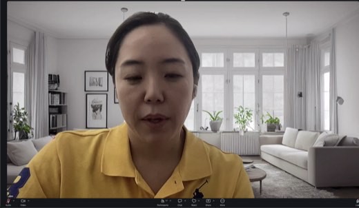 Same gallery, Jaeyoung Lee looking down mid-sentence
